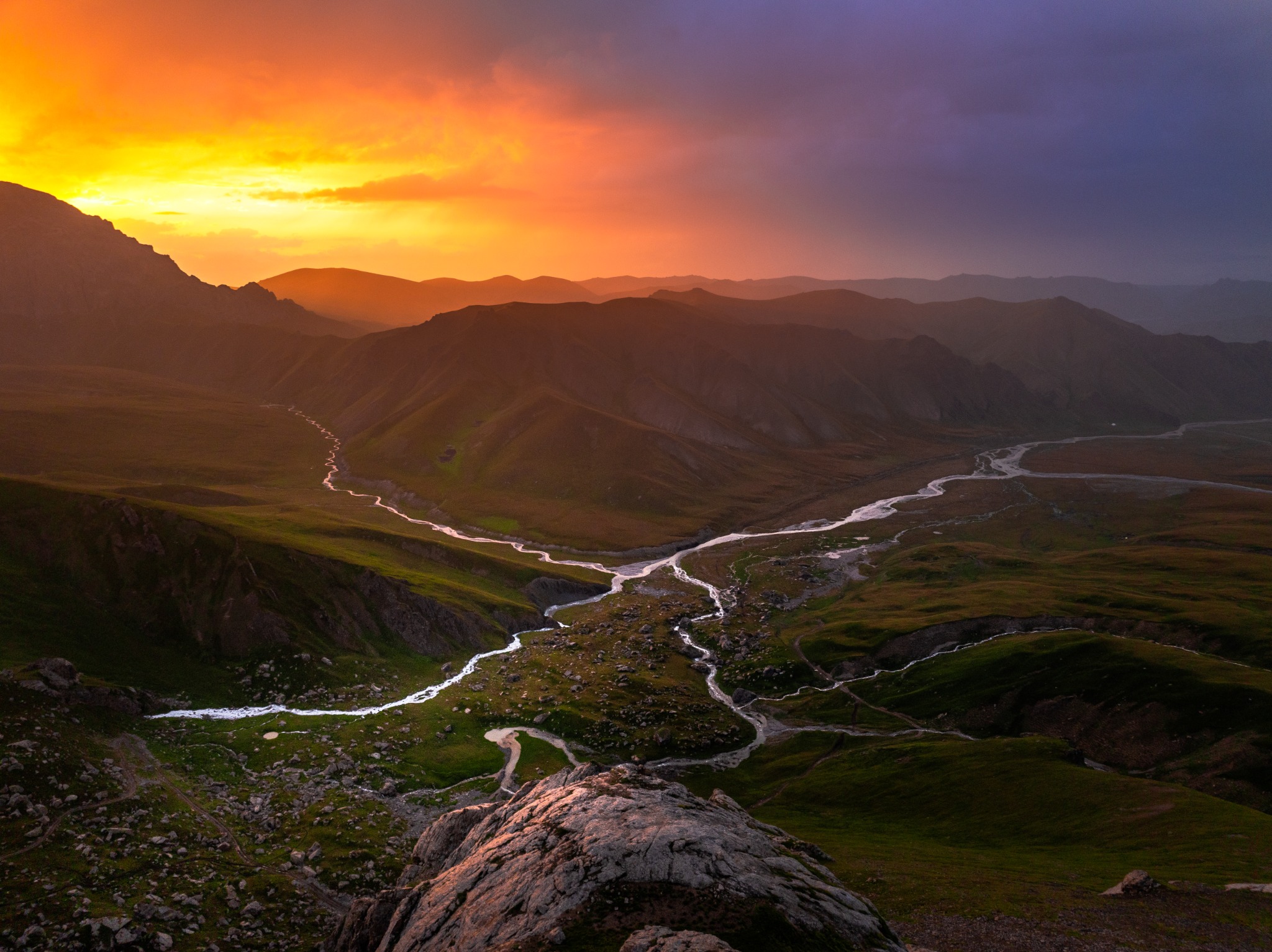 Approved sunset photograph of a winding mountain river valley