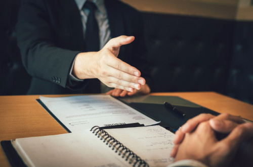 Business man offering hand shake